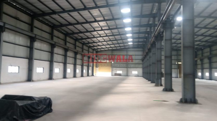 spacious and well-maintained industrial shed available for lease in Khopoli, Navi Mumbai's TTC Industrial Area. The shed features ample workspace, ample power supply, and convenient access to transportation.