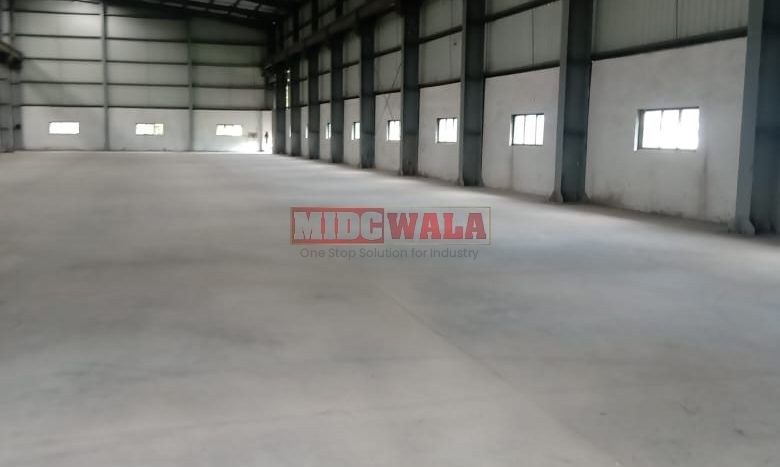 spacious and well-maintained industrial shed available for lease in Khopoli, Navi Mumbai's TTC Industrial Area. The shed features ample workspace, ample power supply, and convenient access to transportation.