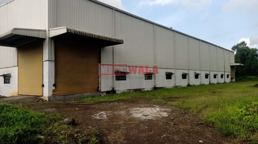 spacious and well-maintained industrial shed available for lease in Khopoli, Navi Mumbai's TTC Industrial Area. The shed features ample workspace, ample power supply, and convenient access to transportation.