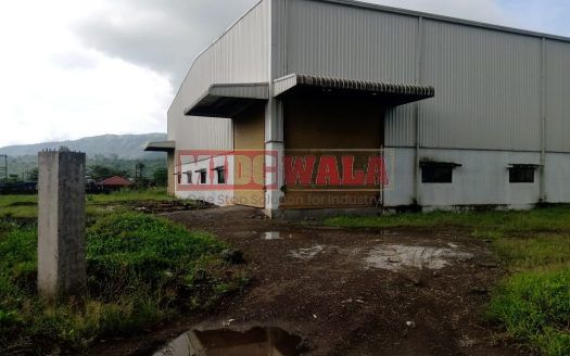 spacious and well-maintained industrial shed available for lease in Khopoli, Navi Mumbai's TTC Industrial Area. The shed features ample workspace, ample power supply, and convenient access to transportation.