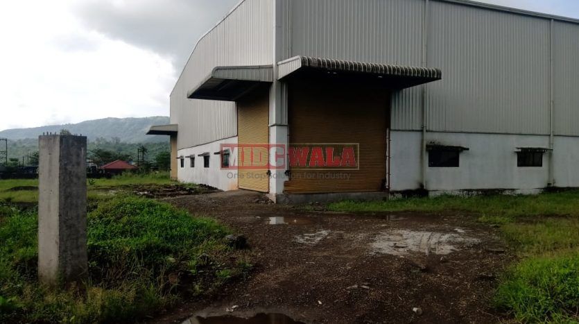 spacious and well-maintained industrial shed available for lease in Khopoli, Navi Mumbai's TTC Industrial Area. The shed features ample workspace, ample power supply, and convenient access to transportation.