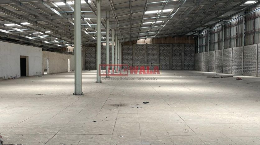 spacious and well-maintained industrial shed available for lease in Juinagar, Navi Mumbai's TTC Industrial Area. The shed features ample workspace, ample power supply, and convenient access to transportation.