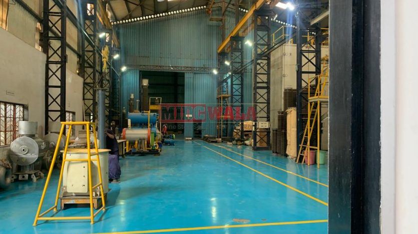 spacious and well-maintained industrial shed available for lease in Rabale, Navi Mumbai's TTC Industrial Area. The shed features ample workspace, ample power supply, and convenient access to transportation.