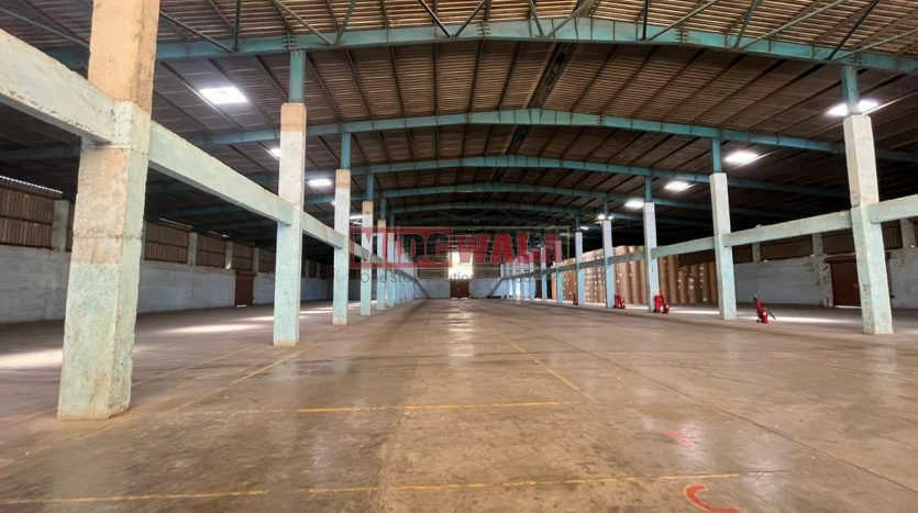 spacious and well-maintained industrial shed available for lease in Khopoli Khalapur, Navi Mumbai's TTC Industrial Area. The shed features ample workspace, ample power supply, and convenient access to transportation.