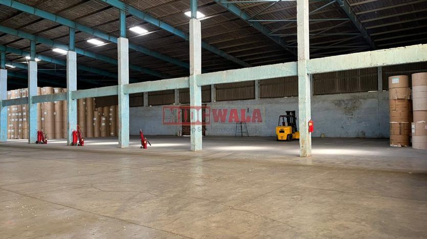 spacious and well-maintained industrial shed available for lease in Khopoli Khalapur, Navi Mumbai's TTC Industrial Area. The shed features ample workspace, ample power supply, and convenient access to transportation.