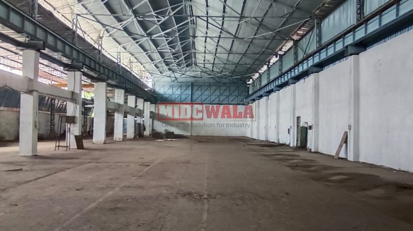 spacious and well-maintained industrial shed available for lease in Rabale, Navi Mumbai's TTC Industrial Area. The shed features ample workspace, ample power supply, and convenient access to transportation.