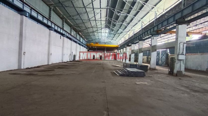 spacious and well-maintained industrial shed available for lease in Rabale, Navi Mumbai's TTC Industrial Area. The shed features ample workspace, ample power supply, and convenient access to transportation.