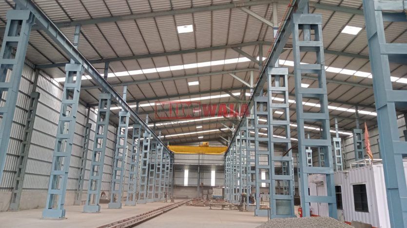 spacious and well-maintained industrial shed available for lease in Taloja, Navi Mumbai's TTC Industrial Area. The shed features ample workspace, ample power supply, and convenient access to transportation.