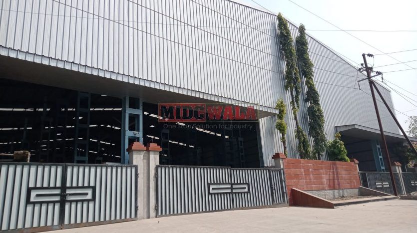 spacious and well-maintained industrial shed available for lease in Taloja, Navi Mumbai's TTC Industrial Area. The shed features ample workspace, ample power supply, and convenient access to transportation.