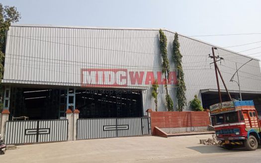 spacious and well-maintained industrial shed available for lease in Taloja, Navi Mumbai's TTC Industrial Area. The shed features ample workspace, ample power supply, and convenient access to transportation.