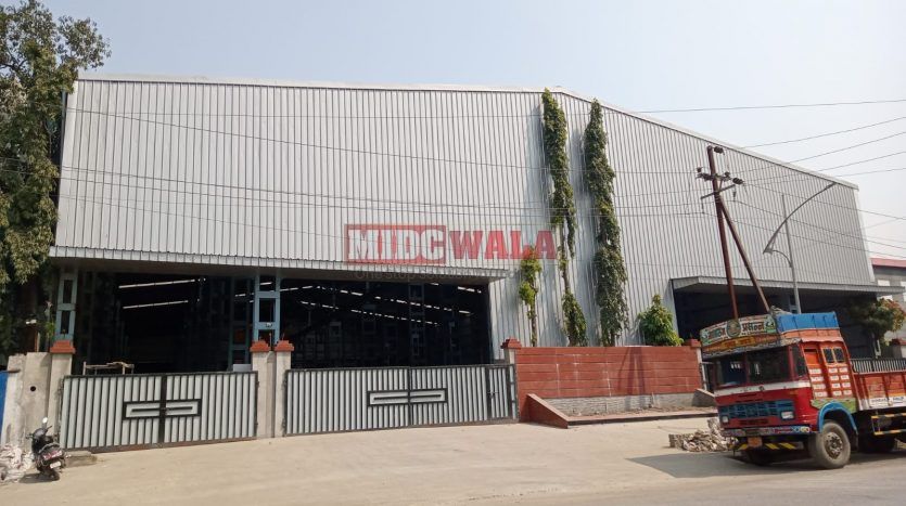 spacious and well-maintained industrial shed available for lease in Taloja, Navi Mumbai's TTC Industrial Area. The shed features ample workspace, ample power supply, and convenient access to transportation.