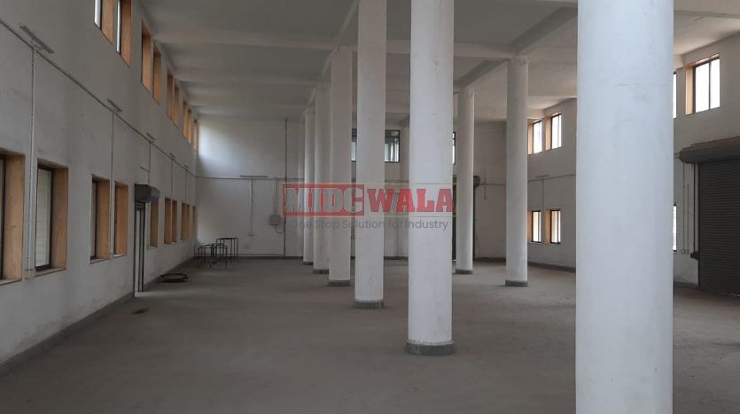 A spacious and modern industrial building available for lease in Navi Mumbai's Koper khairane Midc, TTC Industrial area. The building features abundant workspace, contemporary amenities, and a strategic location.