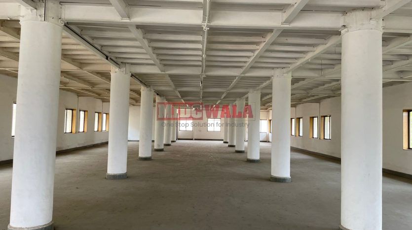 A spacious and modern industrial building available for lease in Navi Mumbai's Koper khairane Midc, TTC Industrial area. The building features abundant workspace, contemporary amenities, and a strategic location.