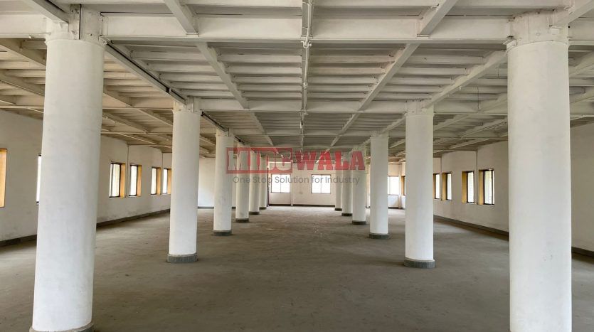 A spacious and modern industrial building available for lease in Navi Mumbai's Koper khairane Midc, TTC Industrial area. The building features abundant workspace, contemporary amenities, and a strategic location.