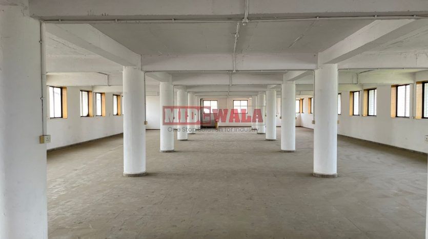 A spacious and modern industrial building available for lease in Navi Mumbai's Koper khairane Midc, TTC Industrial area. The building features abundant workspace, contemporary amenities, and a strategic location.