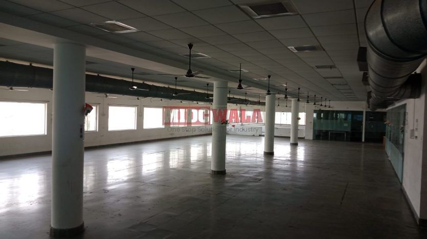 A spacious and modern industrial building available for lease in Navi Mumbai's Koper khairane Midc, TTC Industrial area. The building features abundant workspace, contemporary amenities, and a strategic location.