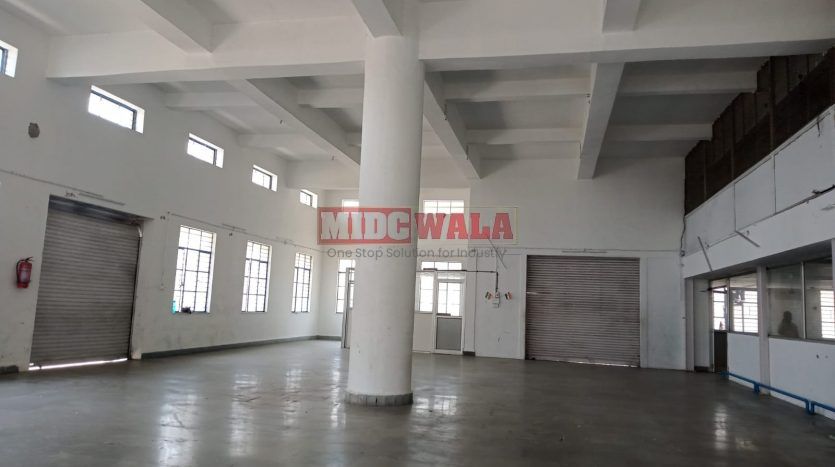 A spacious and modern industrial building available for lease in Navi Mumbai's Koper khairane Midc, TTC Industrial area. The building features abundant workspace, contemporary amenities, and a strategic location.