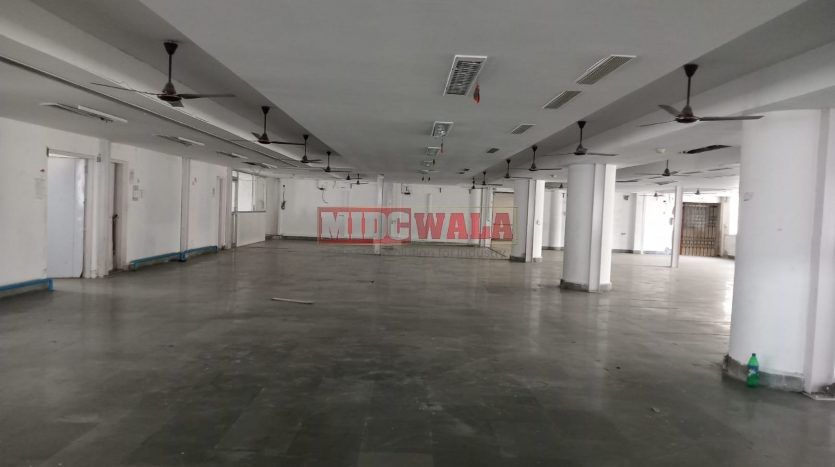 A spacious and modern industrial building available for lease in Navi Mumbai's Koper khairane Midc, TTC Industrial area. The building features abundant workspace, contemporary amenities, and a strategic location.