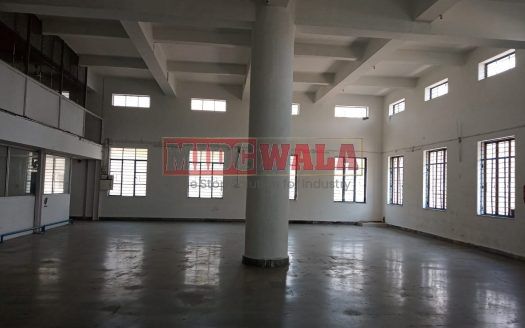 A spacious and modern industrial building available for lease in Navi Mumbai's Koper khairane Midc, TTC Industrial area. The building features abundant workspace, contemporary amenities, and a strategic location.