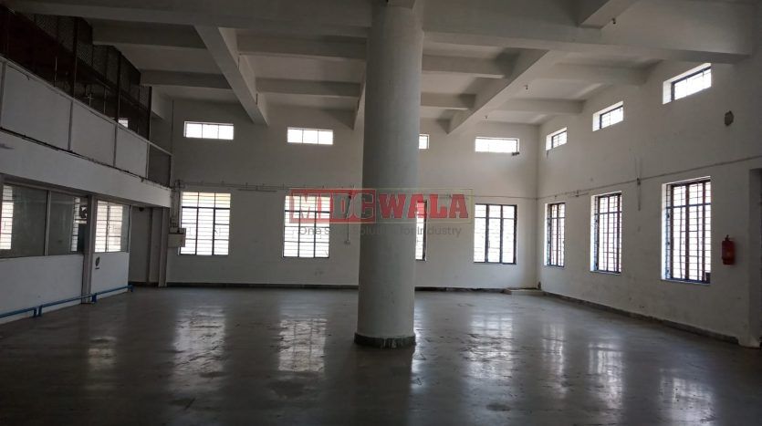 A spacious and modern industrial building available for lease in Navi Mumbai's Koper khairane Midc, TTC Industrial area. The building features abundant workspace, contemporary amenities, and a strategic location.