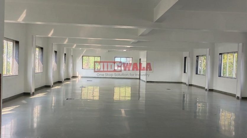 A spacious and modern RCC industrial building available for lease in Rabale Navi Mumbai's Koper khairane Midc, TTC Industrial area. The building features abundant workspace, contemporary amenities, and a strategic location.