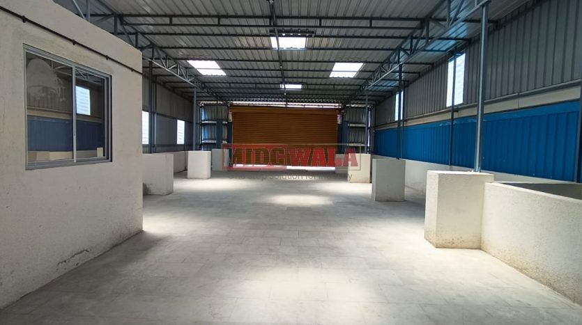 spacious and well-maintained industrial Building available for lease in Rabale, Navi Mumbai's TTC Industrial Area. The shed features ample workspace, ample power supply, and convenient access to transportation.