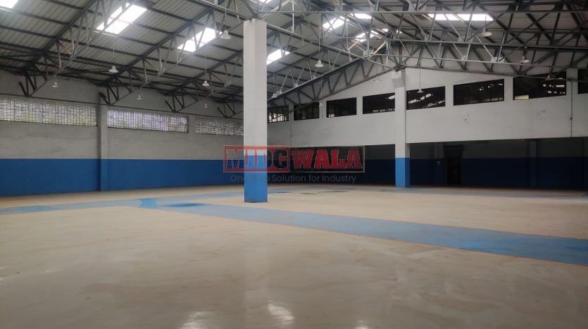 spacious and well-maintained industrial shed available for lease in Panvel, Navi Mumbai's TTC Industrial Area. The shed features ample workspace, ample power supply, and convenient access to transportation.