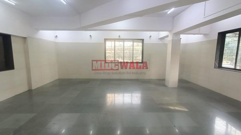 spacious and well-maintained industrial shed available for lease in Panvel, Navi Mumbai's TTC Industrial Area. The shed features ample workspace, ample power supply, and convenient access to transportation.