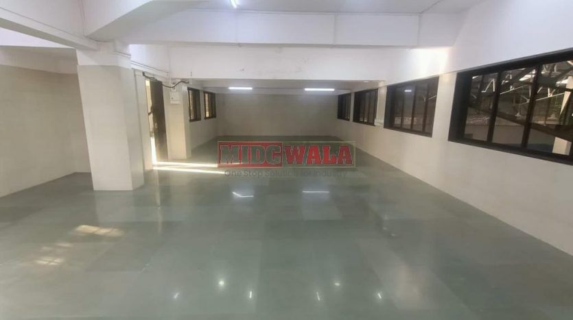 spacious and well-maintained industrial shed available for lease in Panvel, Navi Mumbai's TTC Industrial Area. The shed features ample workspace, ample power supply, and convenient access to transportation.