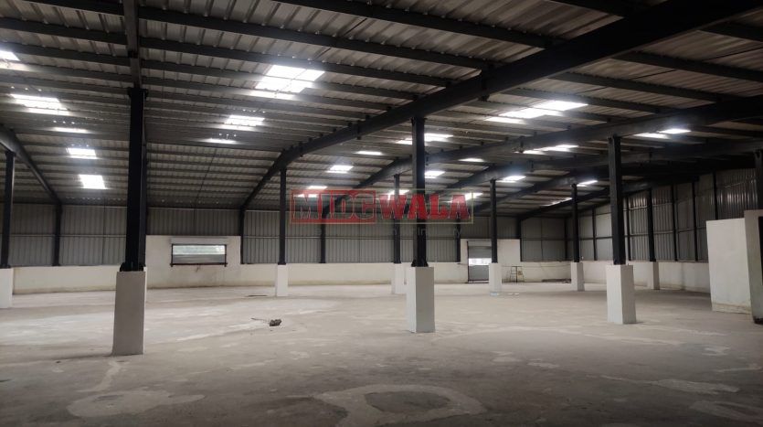 spacious and well-maintained industrial shed available for lease in Panvel, Navi Mumbai's TTC Industrial Area. The shed features ample workspace, ample power supply, and convenient access to transportation.