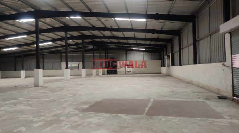 spacious and well-maintained industrial shed available for lease in Panvel, Navi Mumbai's TTC Industrial Area. The shed features ample workspace, ample power supply, and convenient access to transportation.