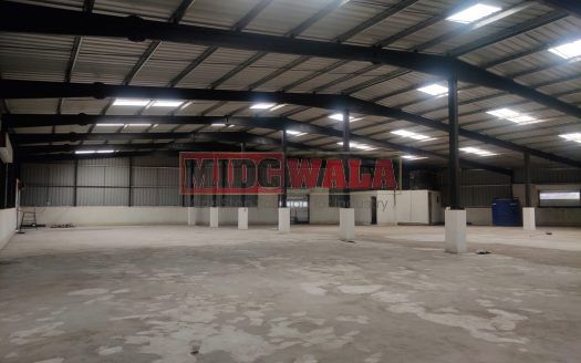 spacious and well-maintained industrial shed available for lease in Panvel, Navi Mumbai's TTC Industrial Area. The shed features ample workspace, ample power supply, and convenient access to transportation.