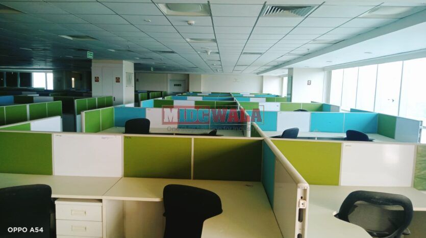 An image showcasing a fully furnished office space at Rupa Solitaire, MBP, Mahape, Navi Mumbai, featuring modern workstations, well-appointed conference rooms, and a vibrant work environment.