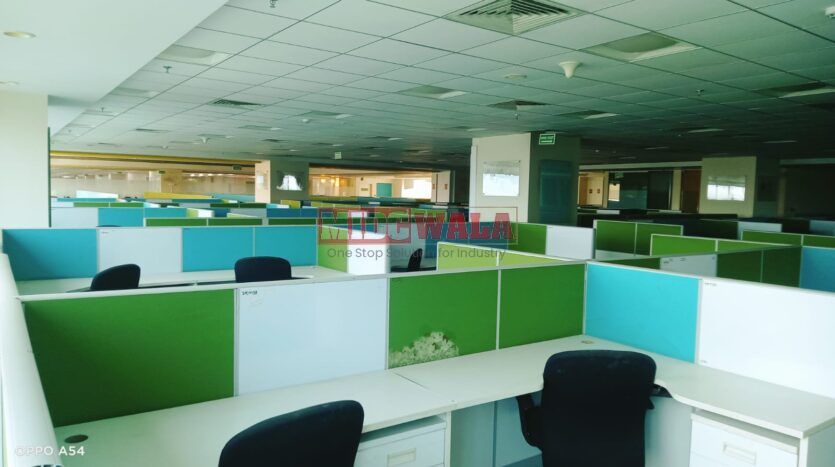 An image showcasing a fully furnished office space at Rupa Solitaire, MBP, Mahape, Navi Mumbai, featuring modern workstations, well-appointed conference rooms, and a vibrant work environment.