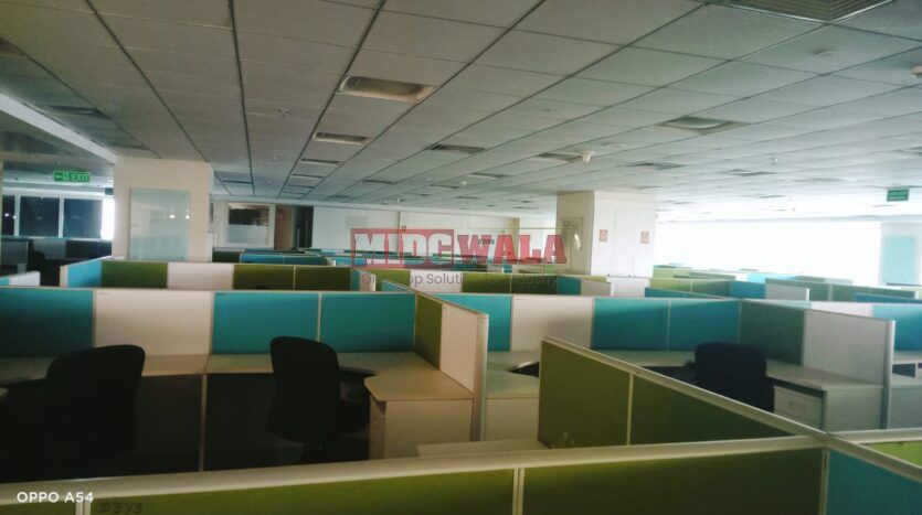 An image showcasing a fully furnished office space at Rupa Solitaire, MBP, Mahape, Navi Mumbai, featuring modern workstations, well-appointed conference rooms, and a vibrant work environment.