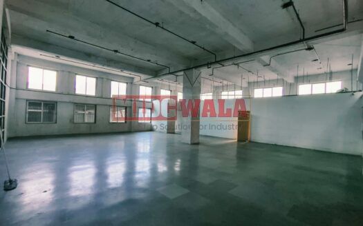 spacious and well-maintained industrial shed available for lease in Turbhe, Navi Mumbai's TTC Industrial Area. The shed features ample workspace, ample power supply, and convenient access to transportation.