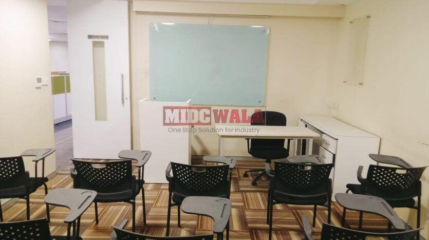 An image showcasing a fully furnished office space at Rupa Solitaire, MBP, Mahape, Navi Mumbai, featuring modern workstations, well-appointed conference rooms, and a vibrant work environment.