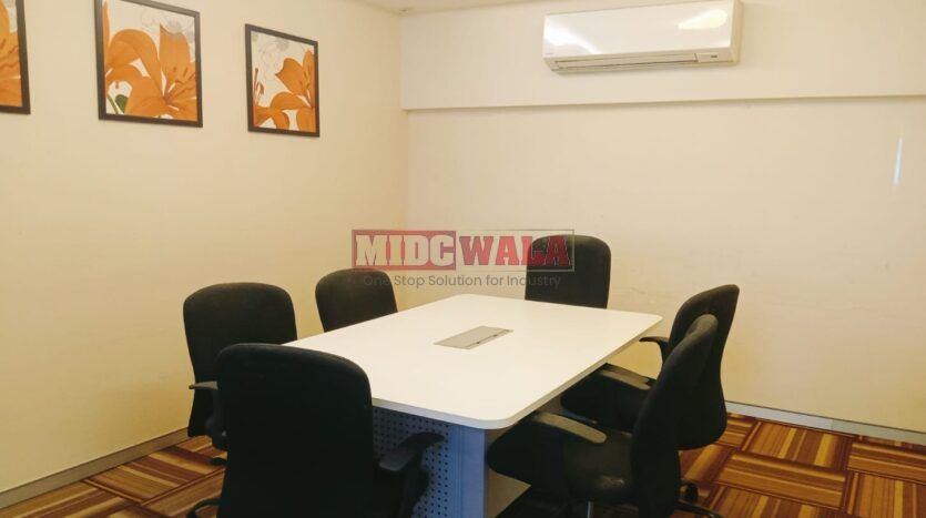 An image showcasing a fully furnished office space at Rupa Solitaire, MBP, Mahape, Navi Mumbai, featuring modern workstations, well-appointed conference rooms, and a vibrant work environment.