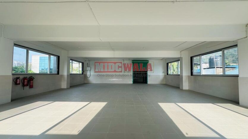 A spacious and modern RCC industrial building available for lease in Navi Mumbai's Nerul Midc, TTC Industrial area. The building features abundant workspace, contemporary amenities, and a strategic location.