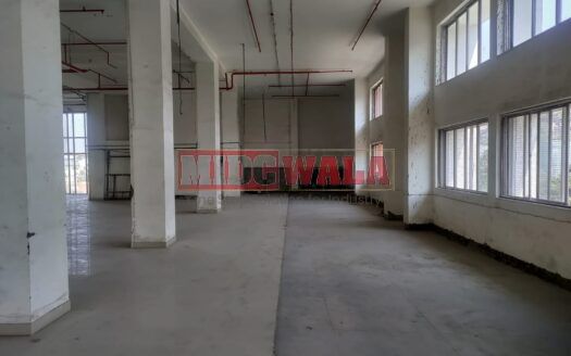 A spacious and modern RCC industrial building available for lease in Navi Mumbai's Juinagar Midc, TTC Industrial area. The building features abundant workspace, contemporary amenities, and a strategic location.