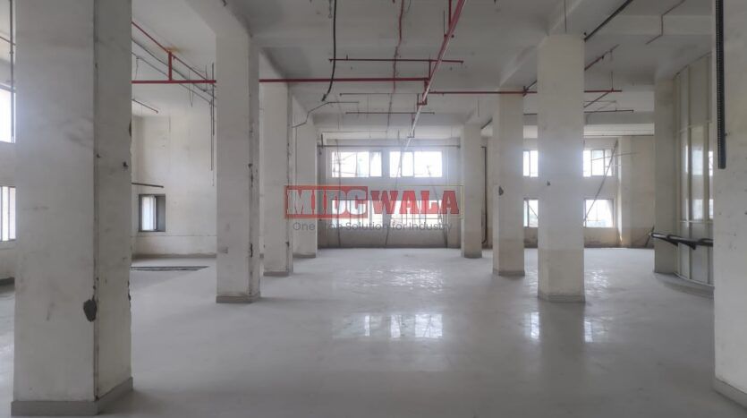 A spacious and modern RCC industrial building available for lease in Navi Mumbai's Juinagar Midc, TTC Industrial area. The building features abundant workspace, contemporary amenities, and a strategic location.