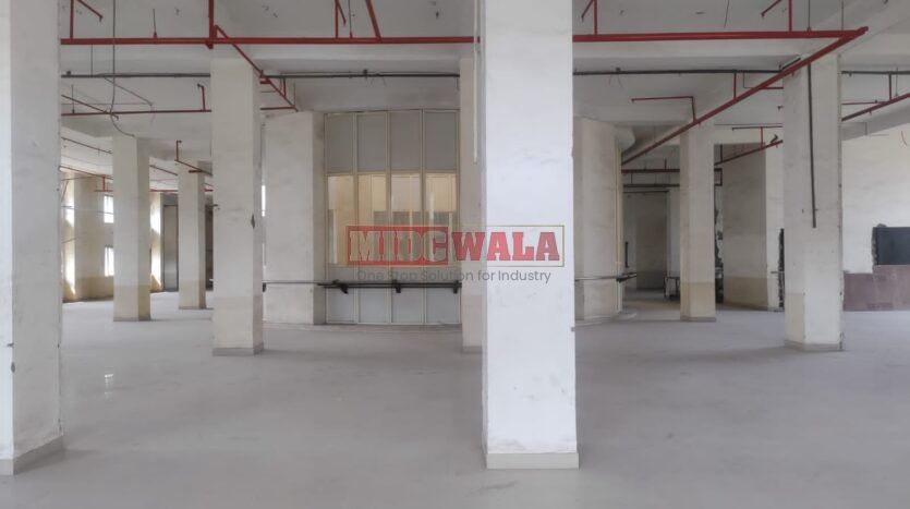 A spacious and modern RCC industrial building available for lease in Navi Mumbai's Juinagar Midc, TTC Industrial area. The building features abundant workspace, contemporary amenities, and a strategic location.