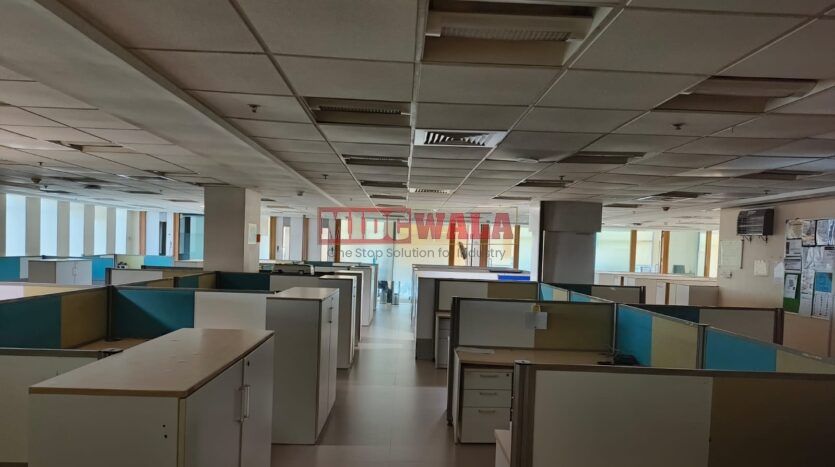 A spacious and modern Manufacturing unit Space for lease in Navi Mumbai's Kopar khairne Midc, TTC Industrial area. The building features abundant workspace, contemporary amenities, and a strategic location.