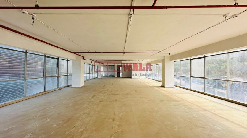 A spacious and modern R&D facility Space for lease in Navi Mumbai's Mahape Midc, TTC Industrial area. The building features abundant workspace, contemporary amenities, and a strategic location.