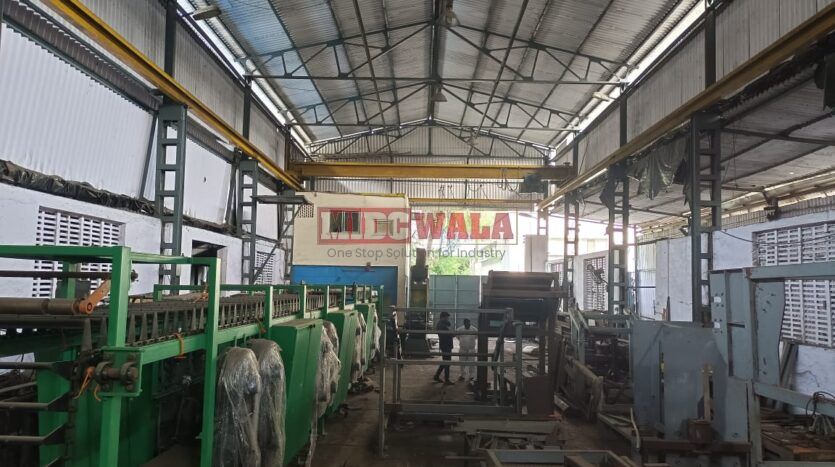 spacious and well-maintained industrial shed available for lease in Rabale, Navi Mumbai's TTC Industrial Area. The shed features ample workspace, ample power supply, and convenient access to transportation.