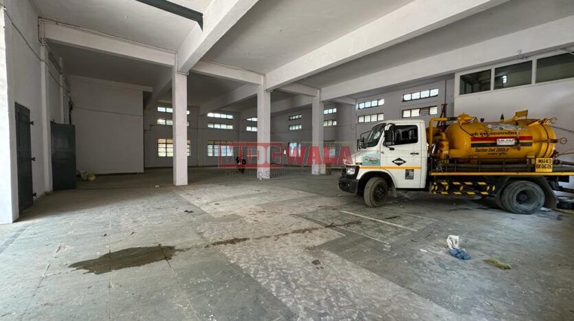 Large, modern warehouse in TTC Industrial Area, Turbhe, Navi Mumbai. Suitable for storage and distribution.