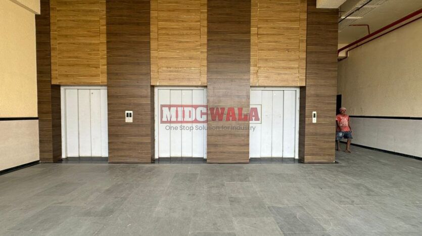 Large, modern warehouse in TTC Industrial Area, Pawane, Navi Mumbai. Suitable for storage and distribution.