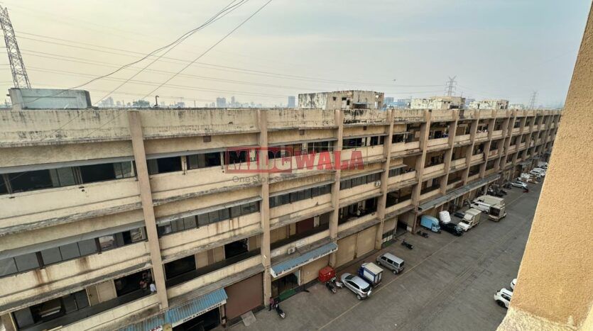 Large, modern warehouse in TTC Industrial Area, Pawane, Navi Mumbai. Suitable for storage and distribution.