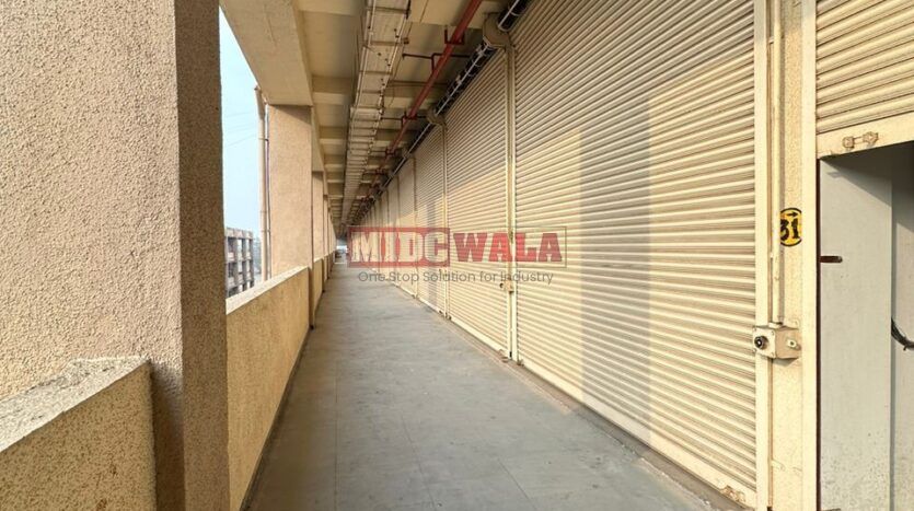 Large, modern warehouse in TTC Industrial Area, Turbhe, Navi Mumbai. Suitable for storage and distribution.