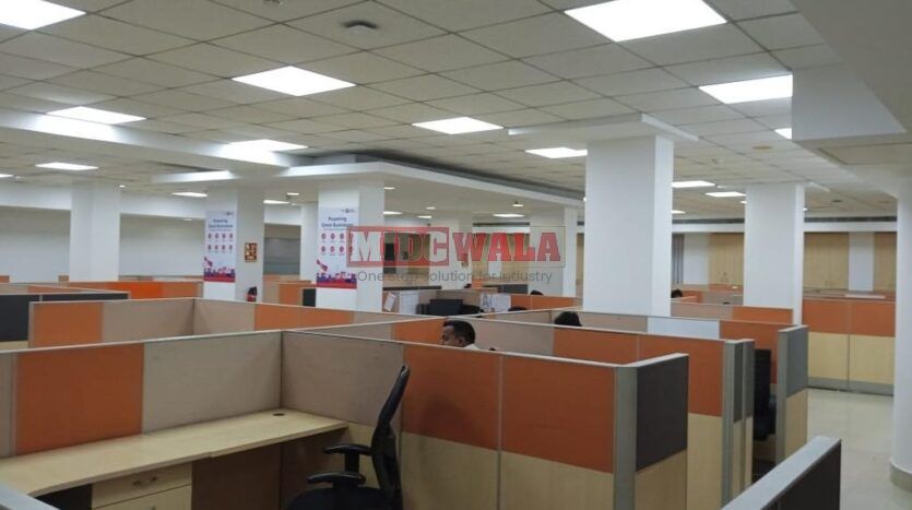 An image showcasing a fully furnished office space in MBP Mahape, Navi Mumbai, featuring modern workstations, well-appointed conference rooms, and a vibrant work environment.